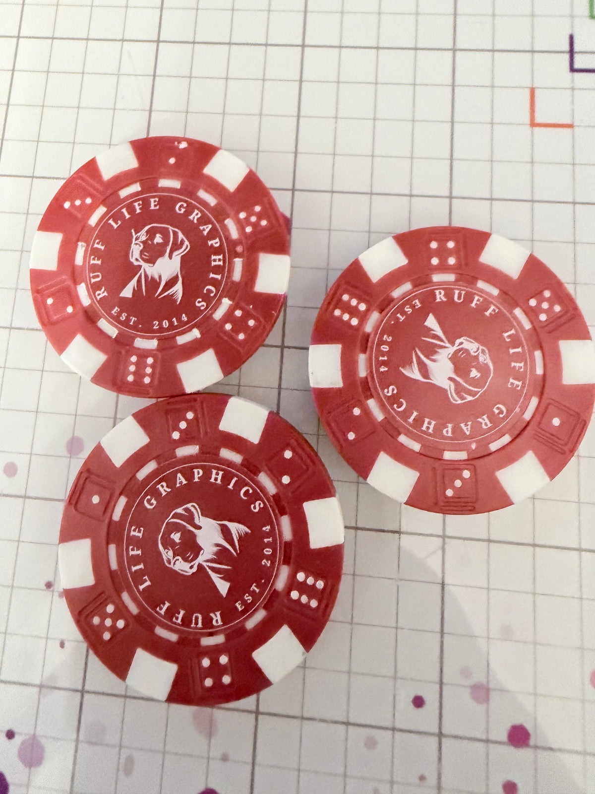 Custom poker chip golf ball marker printed with a tournament logo