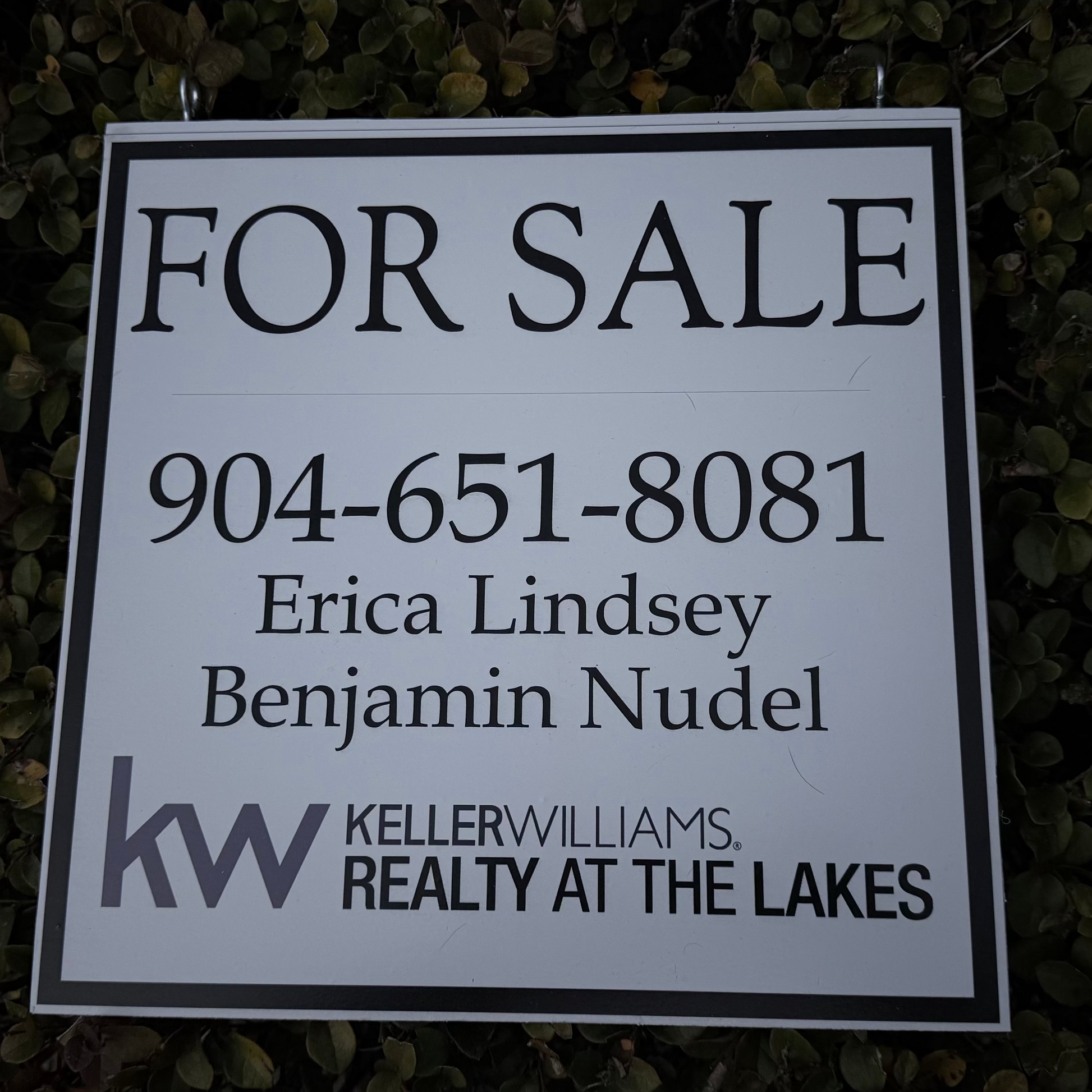 For sale sign with contact information and Keller Williams logo on a dark background