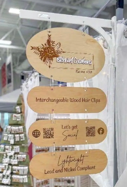 Wooden signboard with text and QR codes in a store setting